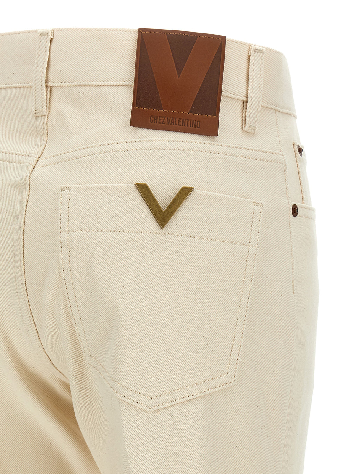 Jeans a zampa d'elefante in cotone beige di Valentino Garavani