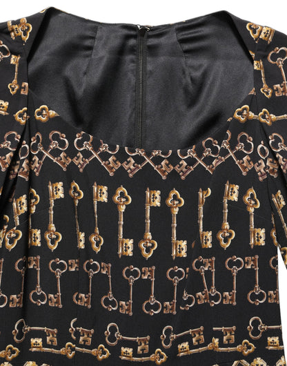 Dolce & Gabbana Schwarzes Etuikleid mit langem Arm und Schlüssel-Print