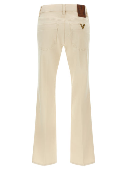 Jeans a zampa d'elefante in cotone beige di Valentino Garavani