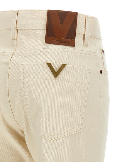 Jeans a zampa d'elefante in cotone beige di Valentino Garavani