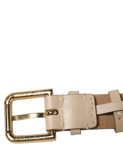 Dolce & Gabbana Armband aus beigem Kalbsleder mit goldener Schnalle