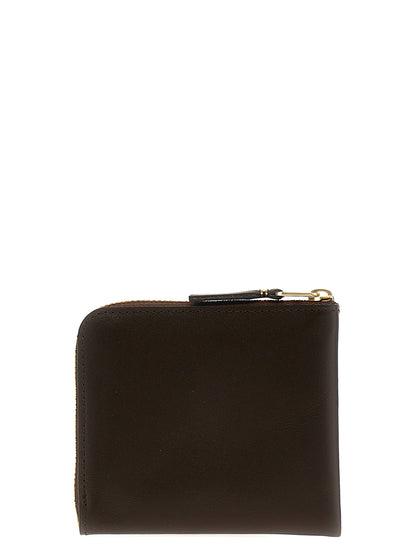 Portacarte Comme Des Garçons in pelle marrone