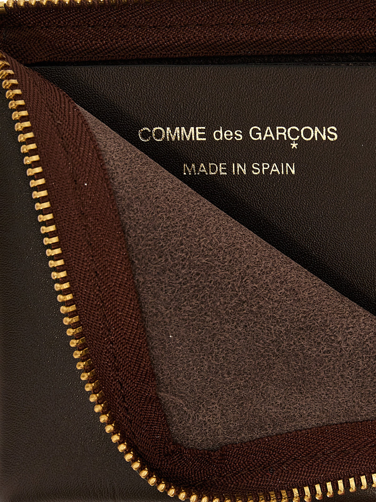 Portacarte Comme Des Garçons in pelle marrone