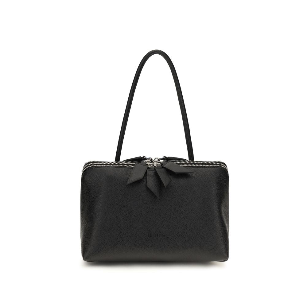 The Attico Schultertasche aus Lackleder in Schwarz