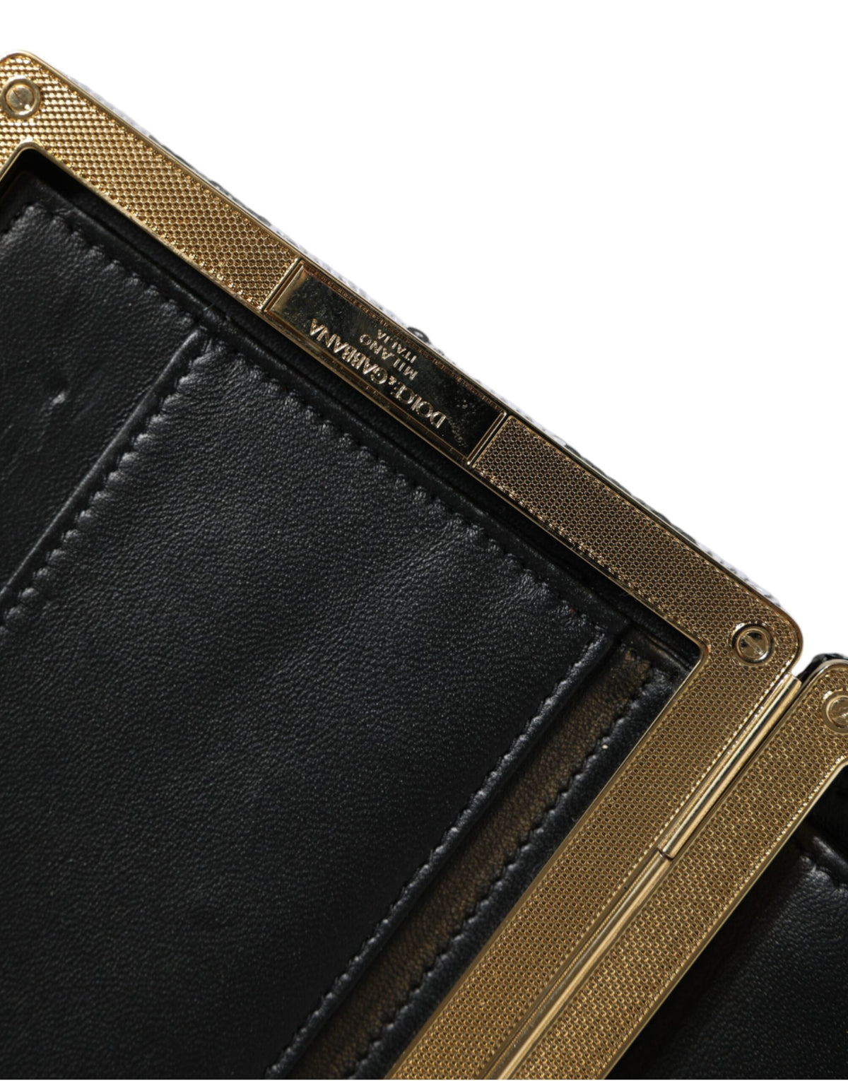 Dolce & Gabbana Schwarz-weiße Mini-Clutch mit goldfarbenem Rahmen