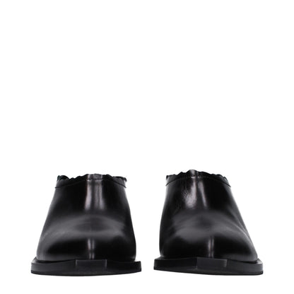Moschino Schwarze Mules aus Leder